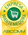 Selo circular dourado com o texto "EMPRESA MANTENEDORA" e um ícone de carrinho de compras, com o texto "ABCOMM" abaixo. Representa certificação ou associação relacionada ao comércio eletrônico.